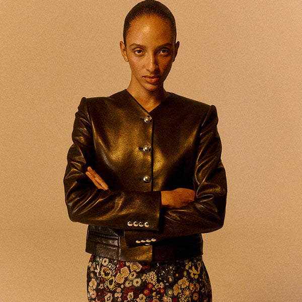 Woman wearing a black leather jacket by Khaite