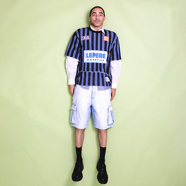 Man wearing LE PERE LPFC Mesh Tee with cargo shorts