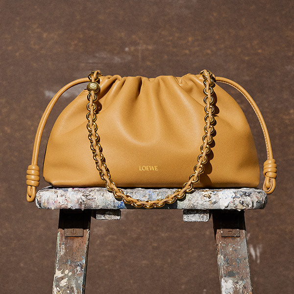 Loewe Flamenco Purse crafted in mellow nappa lambskin in a ruched design featuring knots at the sides