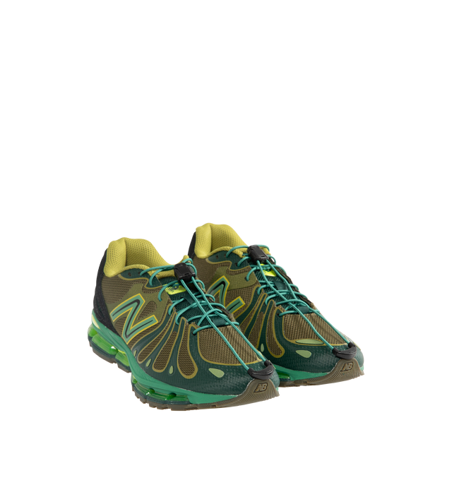 Image 2 of 5 - GREEN - New Balance 1890 Mens Sneakers feature a synthetic upper with a classic lace-up silhouette. Designed with ABZORB midsole cushioning for enhanced impact absorption, all-day comfort, and a durable rubber outsole. Upper: Synthetic; Midsole: ABZORB. Made in Vietnam. 
