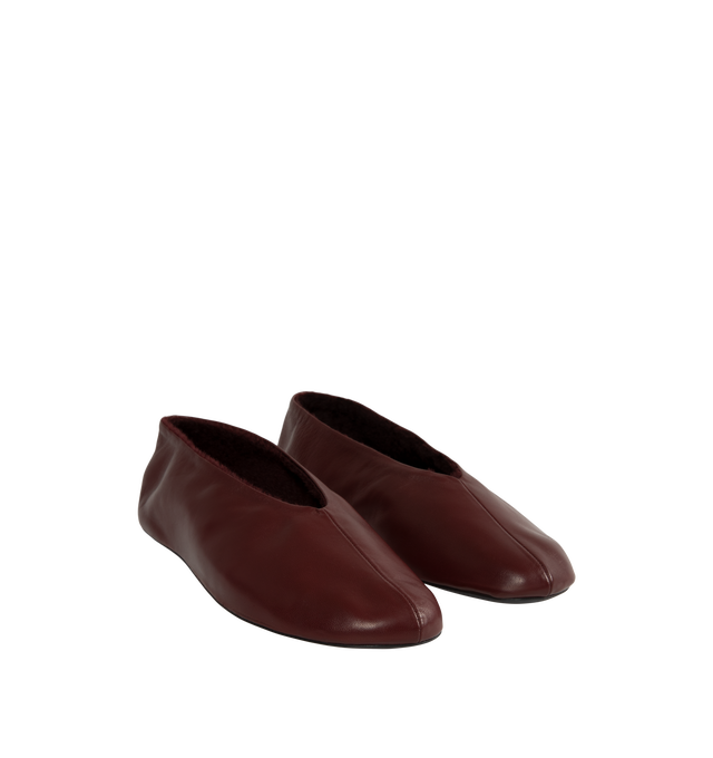 Image 2 of 4 - RED - The Row Women's Stella Slippers are crafted from smooth nappa lambskin leather and feature a slip-on silhouette with an oval toe, soft shearling lining, and a flexible rubber-coated sole. These designer leather slippers combine exceptional Italian craftsmanship with luxurious comfort, making them an elevated choice for effortless everyday wear. Main Material: 100% Lambskin Leather. Lining: Shearling. Sole: Rubber-Coated. Made in Italy. 