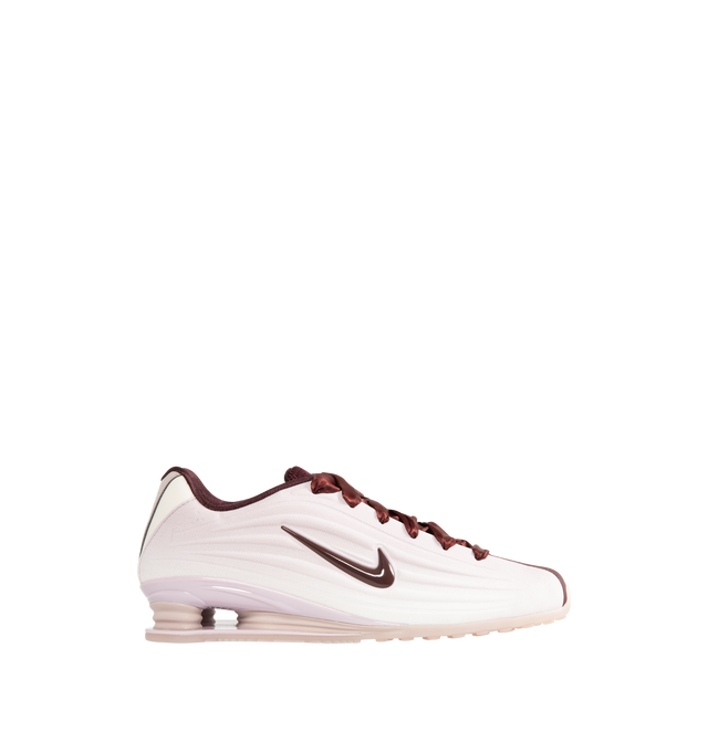 Image 1 of 5 - RED - NIKE Shox Z SE Sneaker featuring a slim, low-profile shape, textile upper, synthetic leather accents, Nike Shox columns, modified, circular Waffle outsole, foam midsole and rubber outsole. 