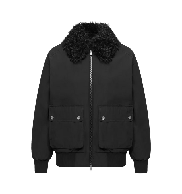 Image 1 of 1 - BLACK - Moncler Women's Rougequeue Hooded Short Down Jacket is crafted from a waxed cotton blend and features a loose, short puffer silhouette with a detachable shearling collar for a refined contrast of texture and warmth. Designed with long sleeves, ribbed knit cuffs and hem, a snap-button front closure, snap-button pockets, and a signature logo patch, this designer down jacket combines functional cold-weather construction with elevated detailing. Exterior: 51% Polyester, 49% Cotton. Ribs:  