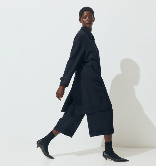 Image 3 of 5 - NAVY - THE ROW Lior Pant featuring tailored low-rise trouser in fluid Japanese wool gabardine with wide cuffed leg, front double pleats, and side slash pockets. 100% wool. Made in Italy. 