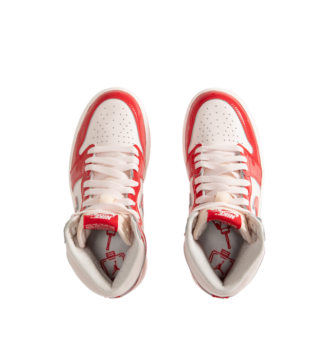 Image 5 of 5 - RED - Jordan Women's Air Jordan 1 Retro High OG "Nails and Grails" Sneakers feature a premium leather upper with glossy University Red patent leather overlays and Light Soft Pink, white, and Metallic Silver accents. Classic Nike Air tongue branding, metal Jumpman and Wings logos, a perforated toe, and a high collar define the design, while a foam midsole with Nike Air cushioning and a rubber outsole complete the construction. Upper: Premium Leather and Patent Leather. Midsole: Foam. Sole: R 