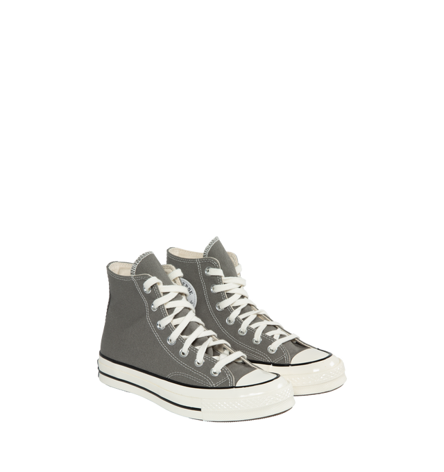GREY - CONVERSE Chuck 70 Hi featuring durable canvas upper, OrthoLite cushioning, egret midsole, ornate stitching, rubber sidewall, Iconic Chuck Taylor ankle patch and vintage All Star license plate. 