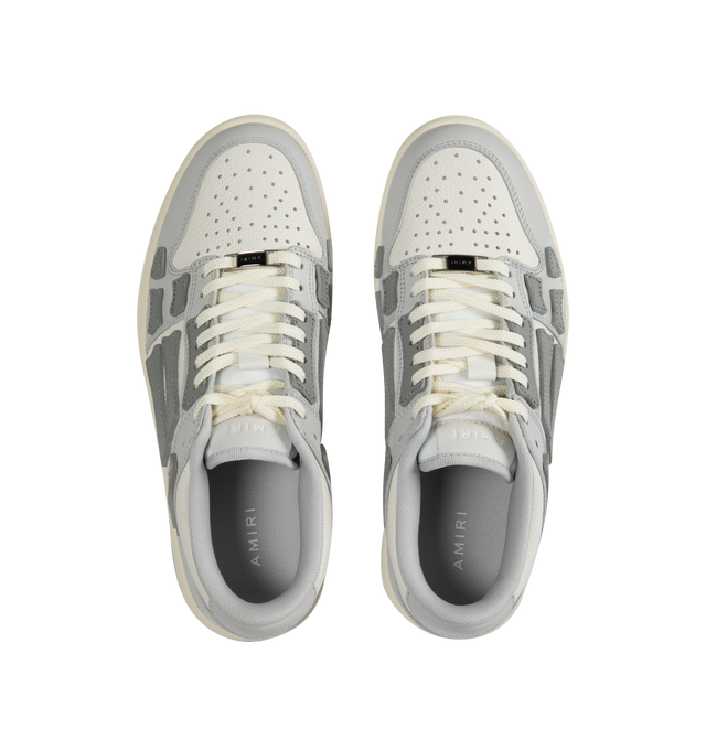 Image 5 of 5 - GREY - AMIRI Skel Top Low Sneakers featuring flat heel, round toe, lace-up vamp, logo on the tongue and heel, padded collar, skeleton motif on the side and rubber outsole. 