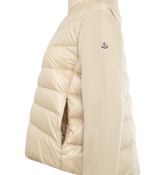 Image 3 of 3 - CHAMPAGNE - MONCLER Padded Cardigan featuring ultra-fine Merino wool, longue saison lining, down-filled longue saison front, rib knit sleeves, gauge 14, zipper closure, zipped pockets and logo patch. 100% polyamide/nylon. 100% virgin wool. Padding: 90% down, 10% feather. 