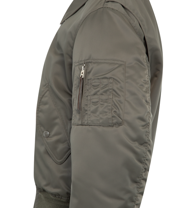 Image 3 of 3 - GREEN - TOM FORD Satin Flight Bomber featuring nylon satin, pocket on the sleeve, two-way zipped front, two front flap pockets, ribbed cuffs and hem and collar. 100% polyamide. Lining: 60% cupro, 40% cotton. Made in Italy.  