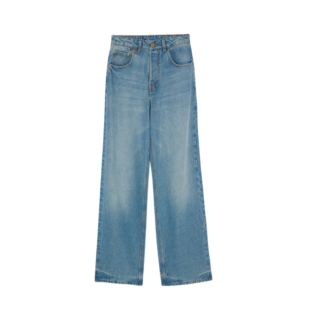 Image 1 of 1 - BLUE - JACQUEMUS Oversized Jeans featuring mid rise, washed indigo denim, long wide leg, J belt loop, five pockets, metal studs and rivets, button fly, large denim patch above back pocket and contrast stitching. 100% cotton. Made in Italy.