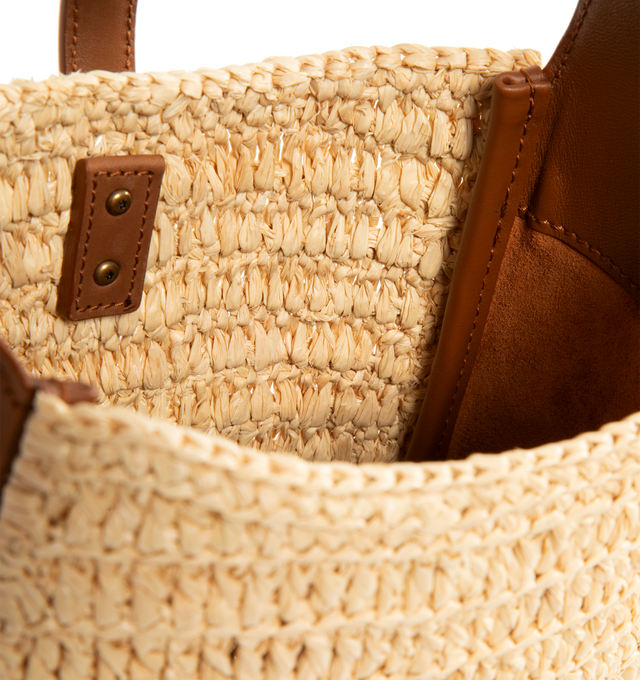 Image 3 of 3 - BROWN - SAINT LAURENT LE 5  7 Supple Baby in raffia and vegetable-tanned leather featuring an inner card holder, leather tab closure decorated with the CASSANDRE, an adjustable strap and bronze-tone hardware. 6.3" x 6.7" x 3". Raffia, calfksin. Made in Italy. 