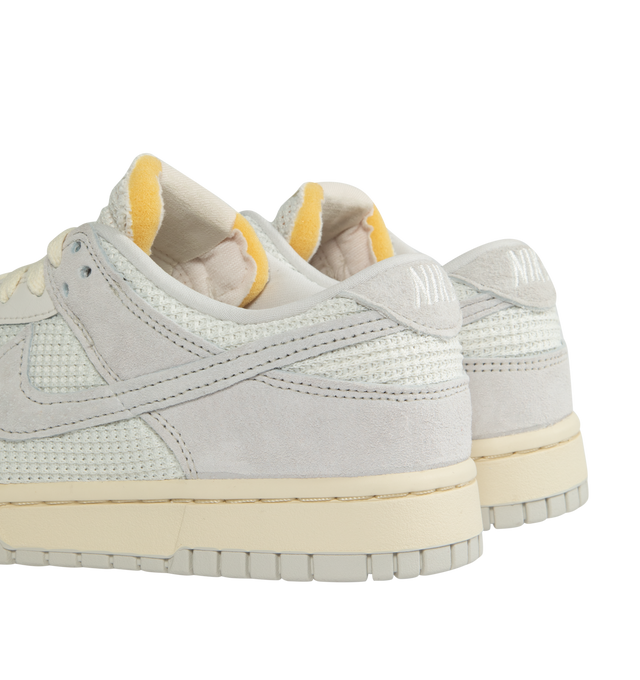 Image 3 of 5 - WHITE - NIKE Dunk low-top sneakers in a lace-up style crafted with leather upper, textile lining and rubber sole. 