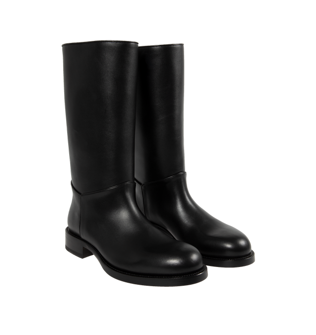 Image 2 of 4 - BLACK - THE ROW Nobilis Riding Boot featuring classic riding boot in silky polished leather with round toe and stacked heel. 1.4 in. heel. 100% calfskin leather. Lined in 100% leather. Made in Italy. 