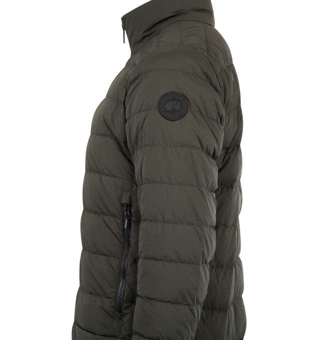 Image 3 of 3 - BROWN - CANADA GOOSE Crofton EnduraLuxe Jacket featuring two-way zipper, packable into interior left pocket, converts into a cinchable bag with a carrying strap, removable interior backpack straps for hands-free carrying capabilities, interior drawcord at hem, two exterior tricot-lined zippered hand pockets and one interior drop-in pocket. 100% recycled polyamide. Made in Canada. 