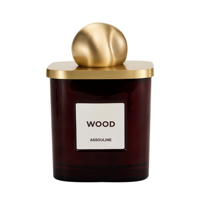 Image 3 of 3 - BROWN - Assouline Library Candle  Wood is a luxury scented candle that captures the warm, inviting ambiance of a wood-paneled library with a refined fragrance blending orange bitters, spice, black currant, hyacinth, smoky exotic woods, and amber. Housed in a heavyweight amber glass vessel with a textured paper label, this designer candle is crafted from a premium soy, coconut, and paraffin wax blend for a clean, even burn and exceptional scent throw. Top Notes: Orange Bitters, Spice. Heart No 