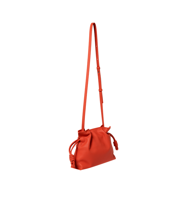 Image 2 of 3 - ORANGE - LOEWE Mini Flamenco Clutch in nappa calfskin featuring a soft and slouchy bag with a cinched closure and historical knot drawstrings, shoulder, crossbody or hand carry, detachable and adjustable strap, discreet magnetic closure, suede lining and embossed Anagram. Nappa calf. 18 cm x 23.9 cm x 9 cm. Made in Spain. 
