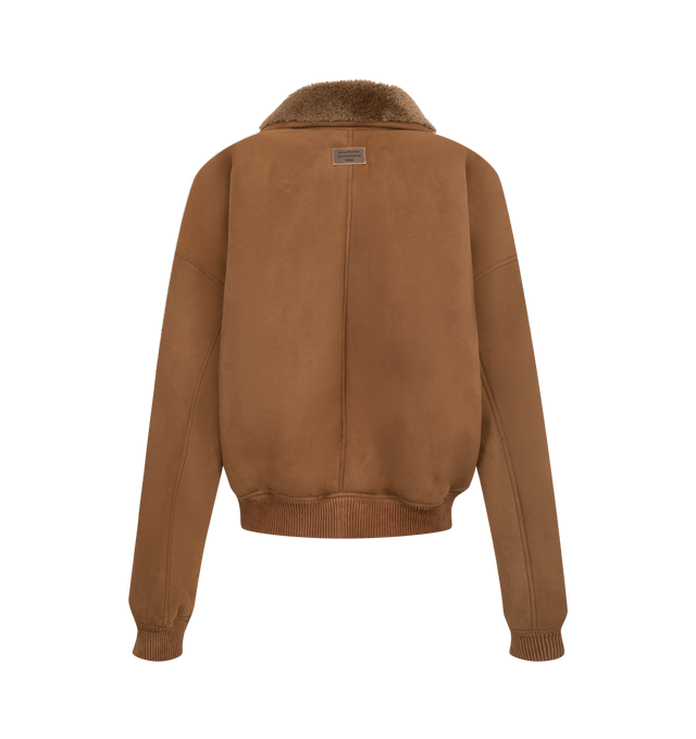 Image 2 of 3 - BROWN - Acne Studios Women's Shearling Bomber Jacket is crafted from lamb shearling and features a relaxed-fit silhouette with a below-waist length, a funnel neckline, and dropped shoulders. Designed with a two-way zip closure, welt pockets, and ribbed trims at the waist and cuffs that create a gathered effect, this elevated outerwear style is finished with a metal logo plaque at the back neckline. Main Material: 100% Lamb Shearling. Contrast: 100% Goat Leather.  
