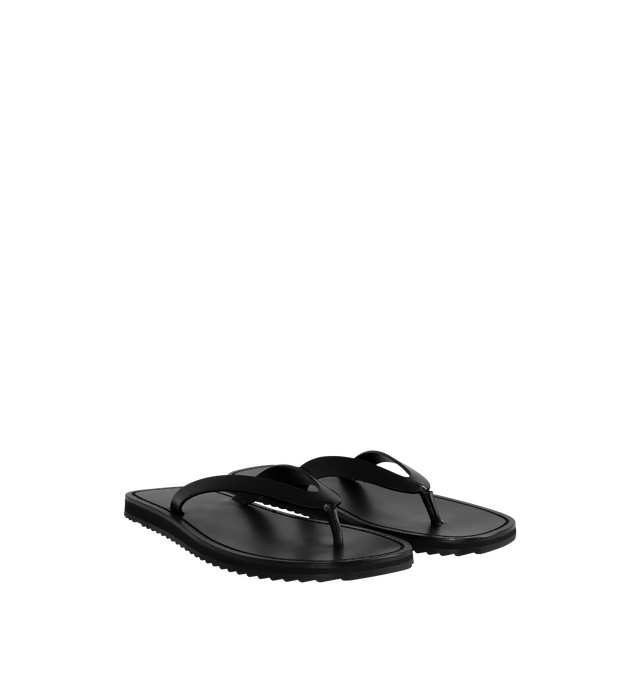 Image 2 of 4 - BLACK - The Row Refined flip flop sandal in shiny calfskin leather with stitched leather detailing and lightly treaded sole. 100% Calfskin Leather. Made in Italy. 