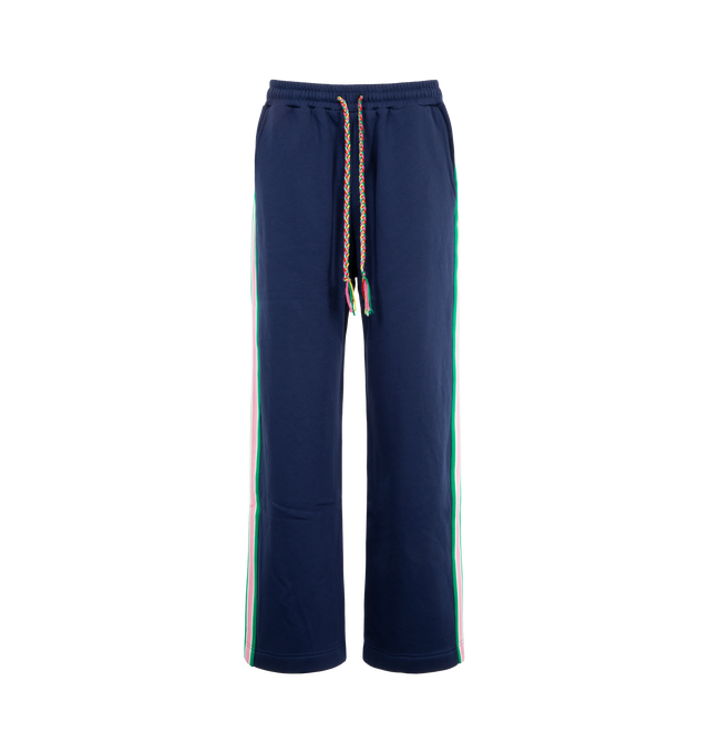 Image 1 of 3 - NAVY - Mira Mikati Women's Striped Rib Jogger with Contrast Poppers is crafted from organic cotton brushback fleece and features a wider, relaxed-fit silhouette designed for elevated everyday comfort. Finished with functional poppers along custom striped rib side panels, an elasticized waistband, and a signature plaited drawcord, this contemporary jogger blends sporty detailing with the brand's playful design aesthetic. Main Material: 100% Organic Cotton. 