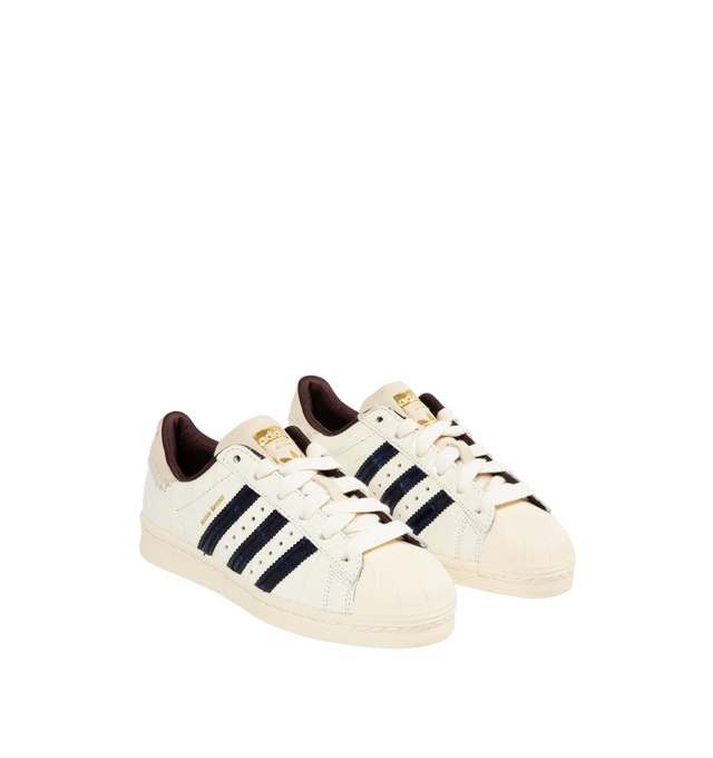 Image 2 of 5 - WHITE - Adidas X Wales Bonner Superstar Sneakers are a lace-up style with croc-embossed leather, signature strips, and rubber soles. 