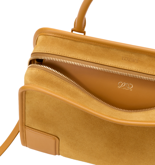 Image 12 of 16 - YELLOW - Loewe Women's Amazona 180 Medium Bag is crafted from suede and calf leather and features a relaxed silhouette with a single toron top handle, a concealed magnetic closure, and removable shoulder and crossbody straps. Designed with two compartments, an internal flat pocket, and a side D-ring for personalization, this versatile style can be carried by hand, over the shoulder, or crossbody. Suede lining and embossed LOEWE branding complete the design. Main Material: Suede/Calf Leather 