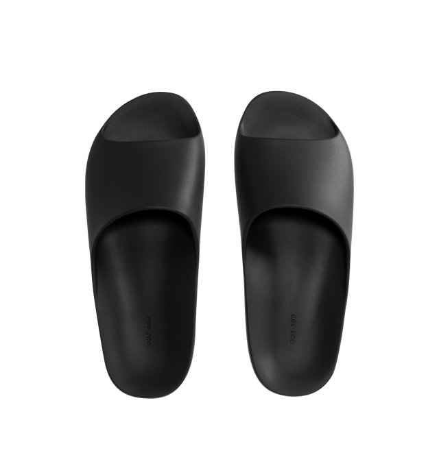 Image 4 of 4 - BLACK - THE ROW Ama Slide featuring smoothly curved slide sandal in lightweight rubber with contoured footbed and seamless construction. 100% rubber. Made in Italy. 