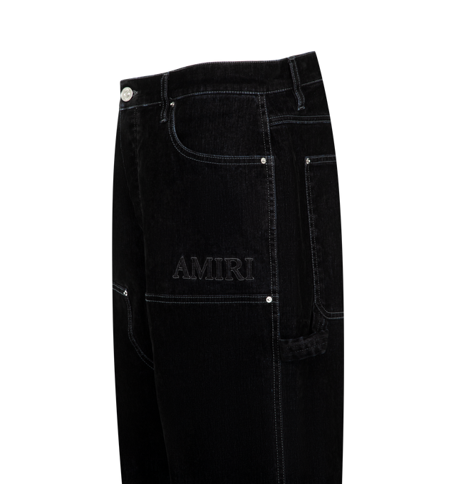 Image 3 of 3 - BLACK - Amiri Men's Flock Denim Carpenter Jeans are crafted from premium cotton denim and feature a relaxed carpenter silhouette with utility-inspired pockets, a hammer loop, and tonal flocked detailing for a textured contemporary finish. These designer jeans combine exceptional Italian craftsmanship with Amiri's signature luxury streetwear aesthetic, creating a statement denim style that blends workwear influences with elevated design. Main Material: 100% Cotton. Made in Italy. 