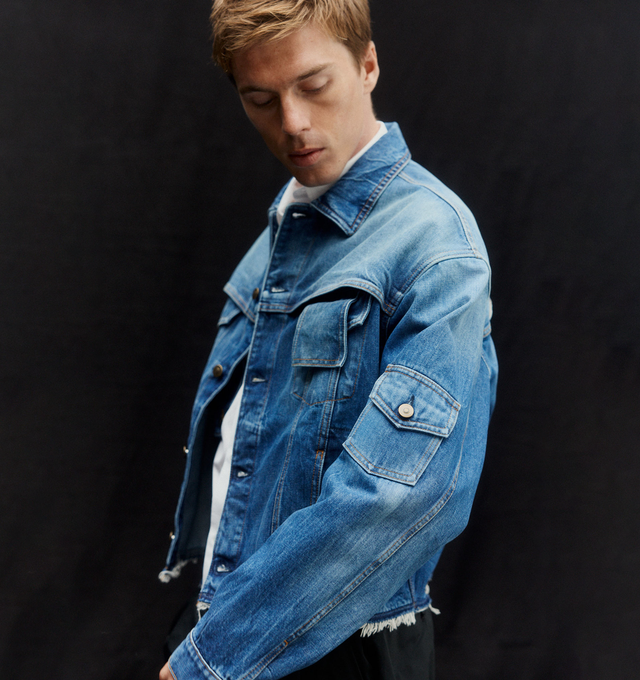 Image 3 of 5 - BLUE - MAISON MARGIELA Denim Jacket featuring cropped proportions, single flap pocket at the elbow, chest flap pocket and a disrupted front pocket, raw hem, button closure and signature four stitches at the back. 100% cotton. Made in Italy. 