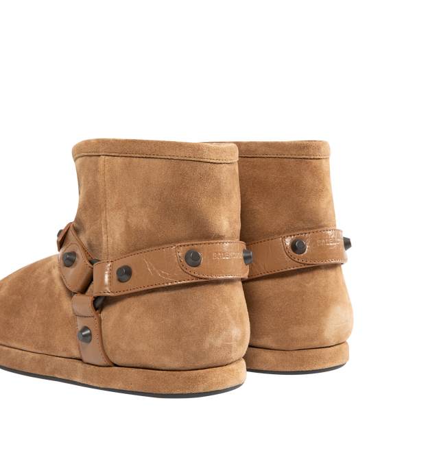 Image 3 of 4 - BROWN - BALENCIAGA Alaska Soft Bootie featuring split calfskin, wool and synthetic material, round toe, harness on the upper with studs and buckles in abs, Balenciaga logo debossed on the back and tone-on-tone sole. Upper: calfskin. Sole: TPU, bio-based TPU. Insole: wool, polyester, acrylic. Made in Italy. 