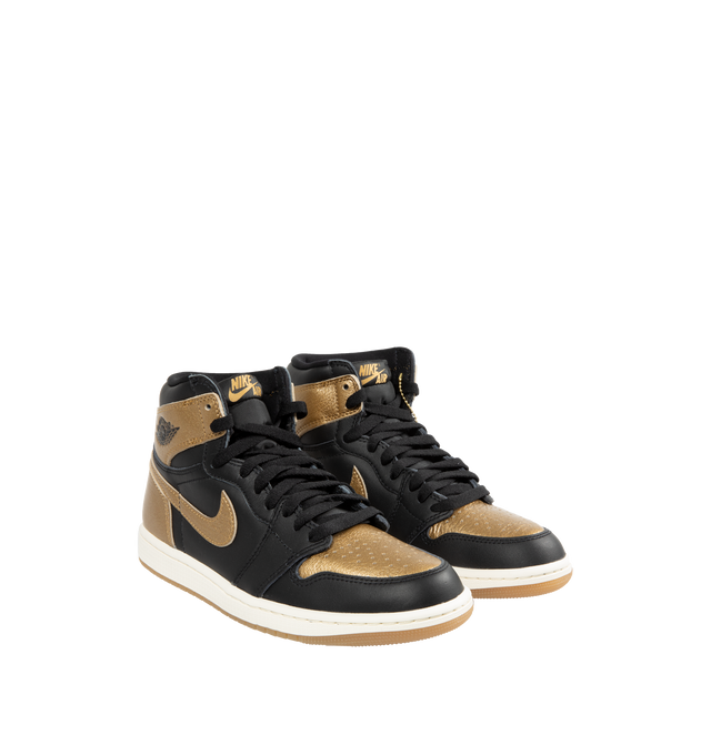 Image 2 of 5 - GOLD - Air Jordan 1 Retro High OG classic sneaker crafted from premium materials. Metallic gold leather upper offers durability and structure. Encapsulated Air-Sole units provide lightweight cushioning. Solid rubber outsoles give you traction on a variety of surfaces. Signature Wings logo stamped on collarStitched-down Swoosh logo. 