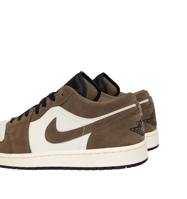 Image 3 of 5 - BROWN - Air Jordan 1 Low Sneakers feature a genuine leather & suede upper with the iconic low-top silhouette for a clean, timeless heritage look. These lifestyle sneakers combine encapsulated Air-Sole cushioning with a durable rubber outsole for lightweight comfort, lasting support, and reliable everyday traction. Main Material: Genuine Leather. Midsole: Encapsulated Air-Sole Unit. Sole: Rubber. 