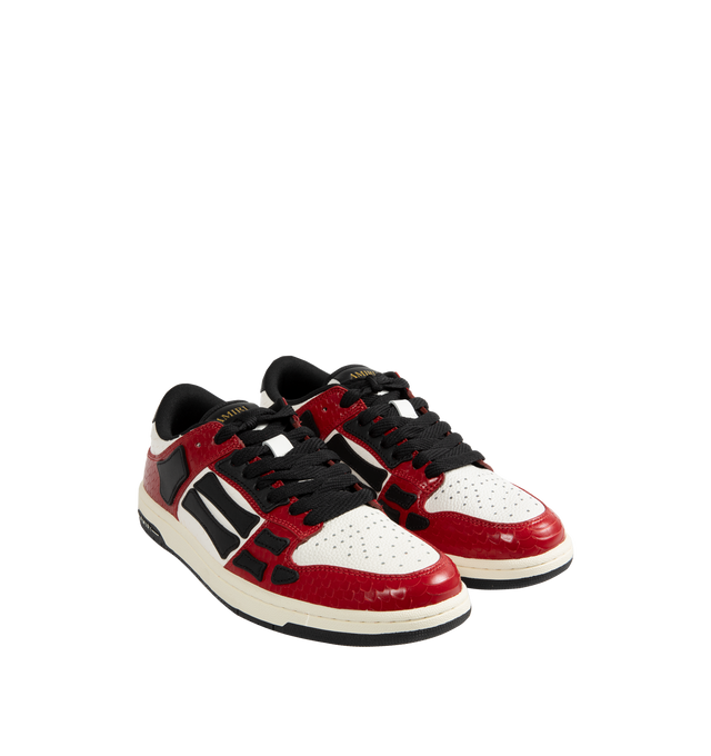 Image 2 of 5 - RED - Amiri Lunar New Year Skel Top Low Sneakers are a lace-up style with perforation details, signature graphics, leather appliques, and two-tone rubber soles. Leather uppers. 