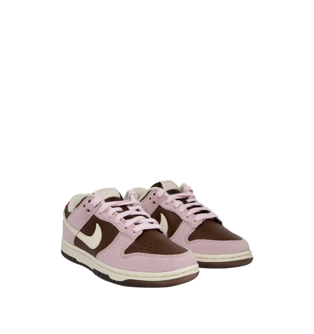 Image 2 of 5 - PINK - Nike Dunk Low Sneakers with "Cacao Wow" brown and "Pink Foam" color-blocking and a cream colored Swoosh,  a padded, low-cut collar, leather upper with a slight sheen and durability, foam midsole offering lightweight, responsive cushioning. Perforations on the toe add breathability. Rubber sole with classic hoops pivot circle provides durability and traction. 