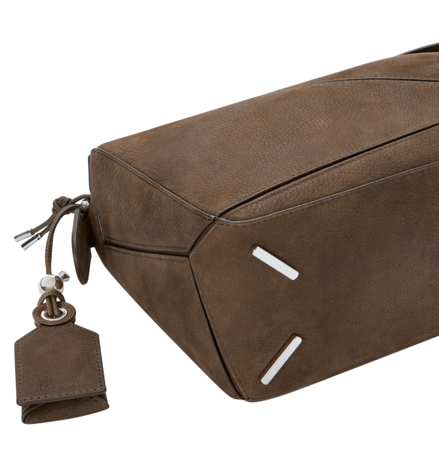 Image 5 of 5 - BROWN - LOEWE Small Featherlight Puzzle bag in grained nubuck featuring distinctive geometric lines and cuboid form, shoulder, crossbody or hand carry, detachable and adjustable strap with rotating dogclips, zip closure with articulated pull, one external zipped rear pocket, one internal slip pocket, detachable LOEWE embossed tag with secret pocket and balloon dice, baguette-shaped metal feet, nappa lambskin lining and embossed Anagram, LOEWE engraved internal plaque. Grained nubuck. 16.5 cm  