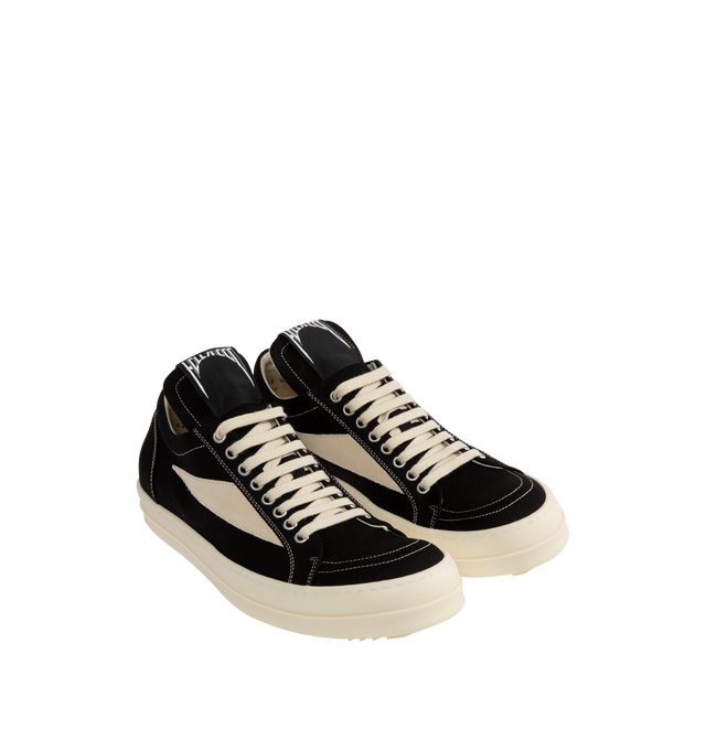 Image 2 of 5 - BLACK - Rick Owens DRKSHDW Vintage Denim Sneakers featuring low-top, lace-up closure, oversized tongue, treaded rubber sole and contrast stitching in white. Upper: cotton. Sole: rubber. Made in Italy. 