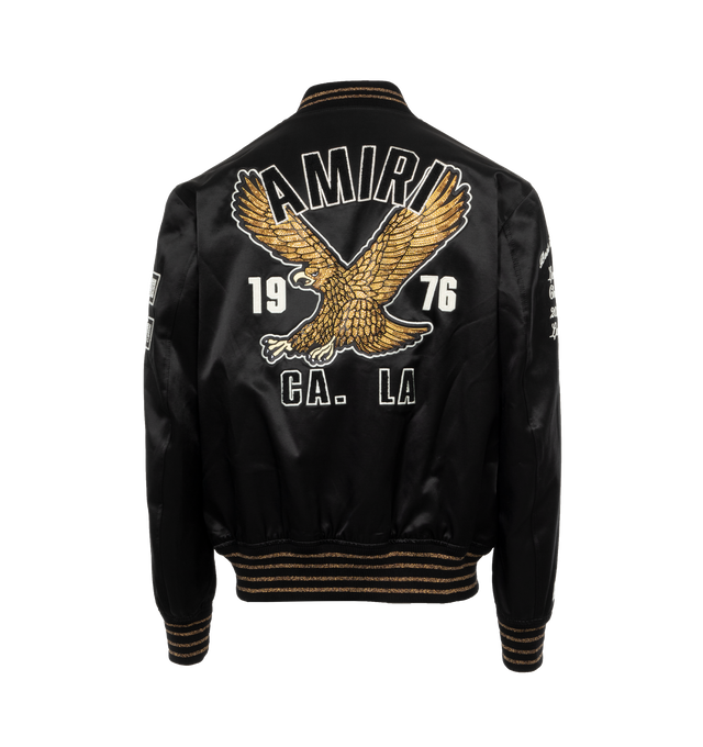 Image 2 of 4 - BLACK - AMIRI Eagle Varsity Bomber Jacket featuring embroidered chest logo, front logo, logo at the back, logo at the back label, side pockets, button fastening, front buttoned closure, long-sleeved and embroidered details. 75% wool, 25% nylon. 