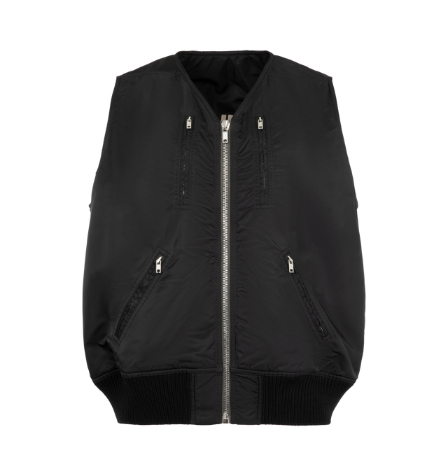 Image 2 of 4 - BLACK - Rick Owens Men's 2 Piece Flight Jacket is crafted from washed bomber satin and features a modular two-piece construction with a sleeveless zip-front body and detachable sleeve overlay. Designed with two vertical zip pockets, two diagonal front zip pockets, zipped forearm pockets, a diagonal upper-arm pocket, and a front strap with metal buckle detail, this runway style combines utilitarian functionality with the brand's signature experimental approach. Finished with rib-knit trims and 