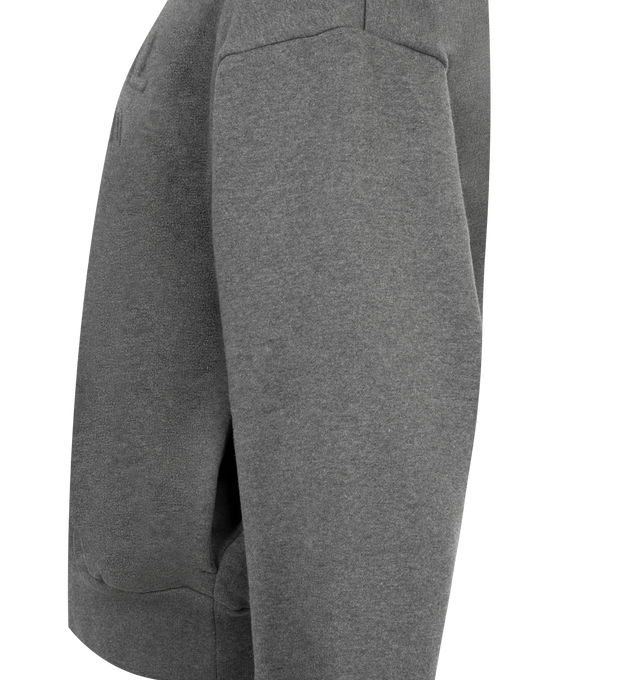 Image 3 of 3 - GREY - FEAR OF GOD ESSENTIALS Classic Hoodie featuring pull-on styling, attached hood, side seam pockets, front embossed logo and heavyweight knit fabric with fleece lining. 80% cotton, 20% polyester. 