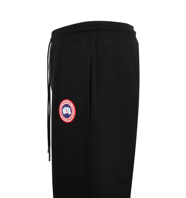 Image 3 of 3 - BLACK - Canada Goose Men's Loon Joggers are crafted from lightweight organic cotton terry with a tight-knit construction, breathable feel, and streamlined finish. Designed for elevated everyday comfort, these designer sweatpants feature an adjustable drawcord waist, two jersey-lined welt pockets, and rib-knit cuffs for a secure fit. Main Material: 100% Organic Cotton. Fabric: Lightweight Cotton Terry. Waist: Drawcord. Pockets: Two Jersey-Lined Welt Pockets. Details: Rib-Knit Cuffs, Classic Ca 