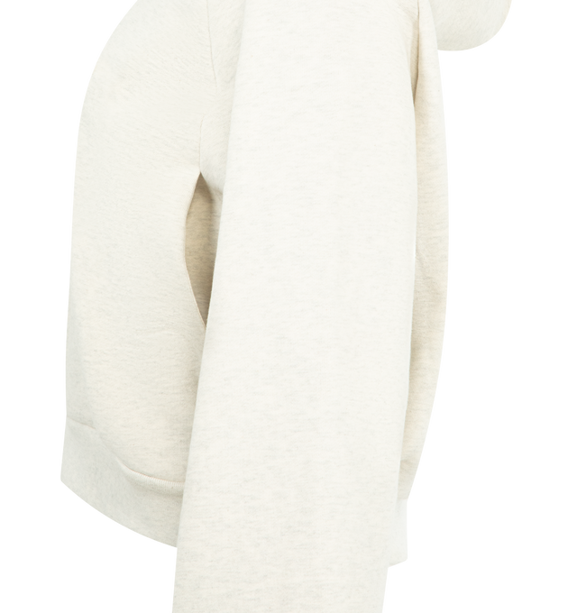 Image 3 of 3 - WHITE - FEAR OF GOD ESSENTIALS 90s Raglan Hoodie featuring cotton-blend fleece hoodie, oversized, rubber logo patch at hood, logo embossed at front, seam pockets, rib-knit cropped hem and cuffs and raglan sleeves. 80% cotton, 20% polyester. 