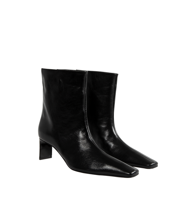 Image 2 of 4 - BLACK - Khaite Ona square-toed ankle boot in black glazed leather featuring sleek blade heel, tonal outsole and a distinctively notched back enhances the pull-on ease. Suede calfskin (100% calfskin). Made in Italy . 