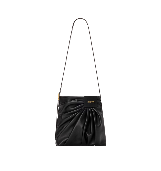 Image 3 of 4 - BLACK - LOEWE Draped Tote featuring soft scultpural shape and a wide strap adorned with a bold LOEWE-engraved buckle, shoulder or crossbody carry, adjustable strap, magnetic closure, one internal calfskin patch pocket, herringbone cotton canvas lining and gold embossed LOEWE. Mellow nappa lambskin. 30 cm x 29 cm x 13 cm. Made in Spain. This item may be restricted for online purchase to international clients. For assistance purchasing this item please contact our dedicated stylist team at pers 