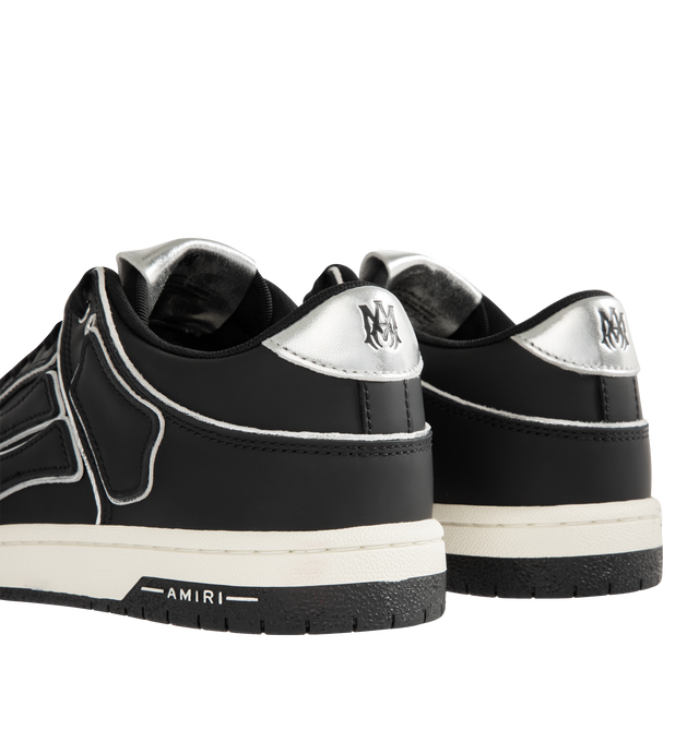 Image 3 of 5 - BLACK - AMIRI Skel Top Low Sneaker featuring round toe, lace-up front, logo patch and contrast trim. 100% Cow Leather. Sole: 100% Rubber. 