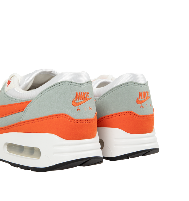 Image 3 of 5 - ORANGE - Nike Air Max 1 86' Premium Sneakers are a lace-up style with a padded low-cut collar, visible Nike Air cushioning, and rubber waffle outsoles.  