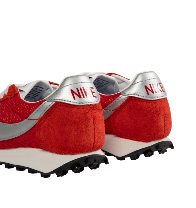 Image 3 of 5 - RED - Nike LD-1000 Sneakers are a lace-up style with removable and cushioned insoles, textile and leather uppers, flared heels, waffle treads, and rubber soles.  