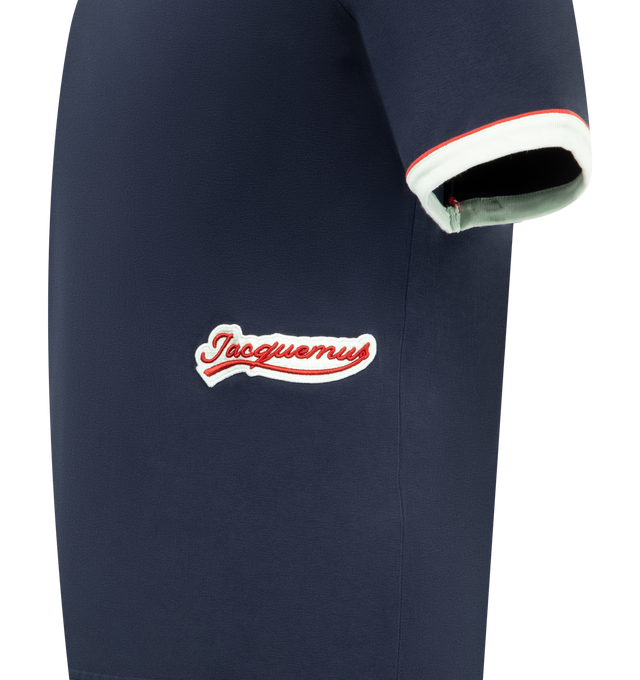 Image 3 of 3 - NAVY - JACQUEMUS Gio T-Shirt featuring slim fit, short sleeves with contrasting ribbed trim, crew neck with contrasting ribbed trim and embroidered logo patch on the left side. 100% cotton. Made in Portugal.  