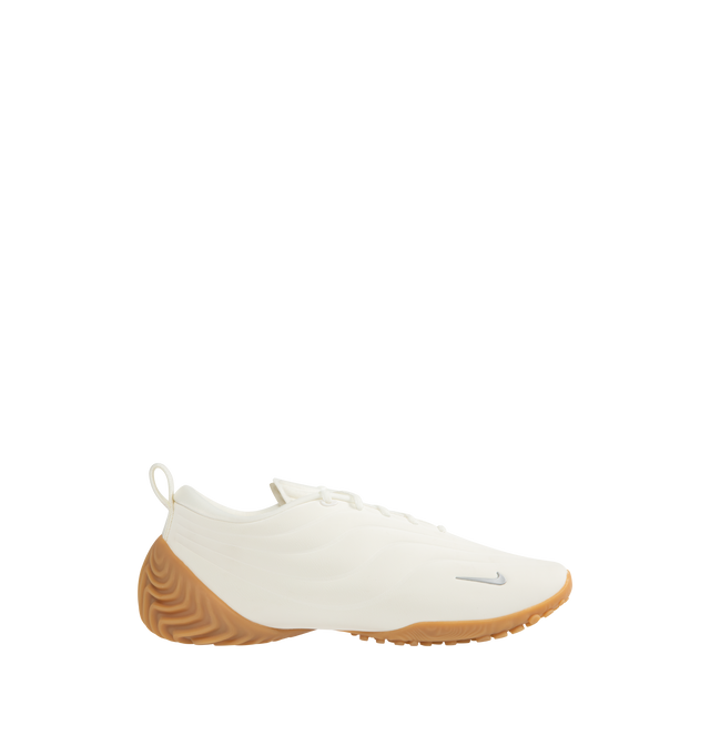 Image 1 of 5 - WHITE - NIKE Astra Ultra Sneaker featuring a low-profile slip-on construction, minimal lace overlays, sculpted heel detailing, silver Swooshes and a gum sole. 