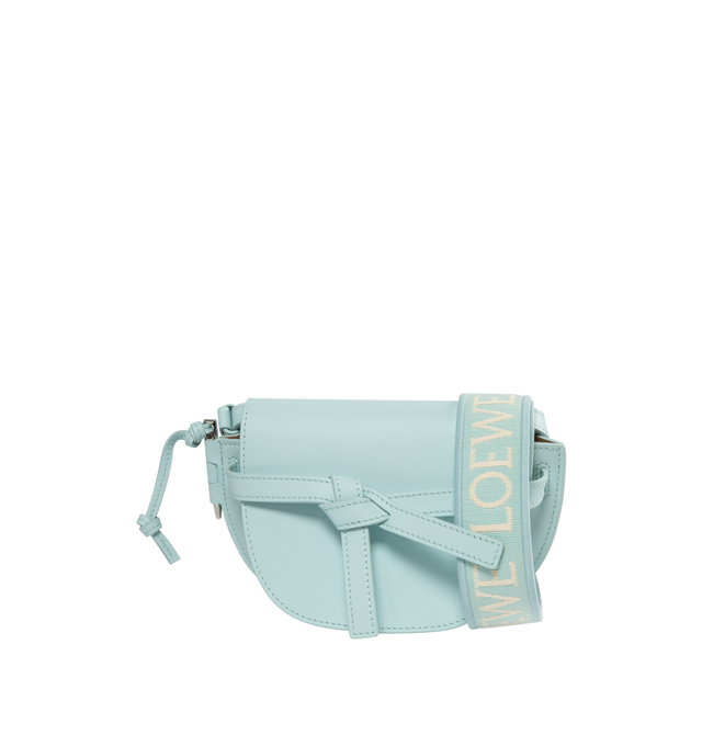 Image 1 of 3 - BLUE - LOEWE Mini Gate Dual bag with a saddle-stitched knotted leather strap and a side-latched metal pin that gives the bag its name. This mini version is crafted in soft calfskin and features a removable shoulder strap in calfskin and jacquard with a repeat LOEWE pattern. Shoulder, crossbody, sling or belt carry. Front flap pulls in under knotted belt for secure fastening.  Two internal slip pockets and suede lining. Embossed Anagram.featuring a shoulder strap. 100% Leather.  