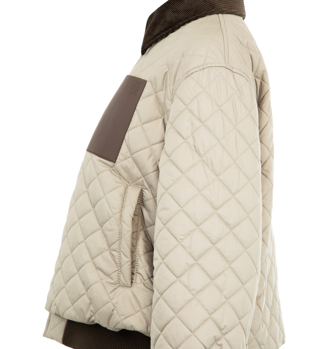 Image 3 of 3 - NEUTRAL - LOEWE Short Jacket in lightweight technical fabric featuring allover diamond quilting, regular fit, short length, corduroy collar and inside cuff, zip front fastening and snap button cuffs, vertical welt pockets, inside welt pocket, contrast rib knit hem and anagram embossed leather patch pocket placed on the chest. Polyester. Made in Italy. 
