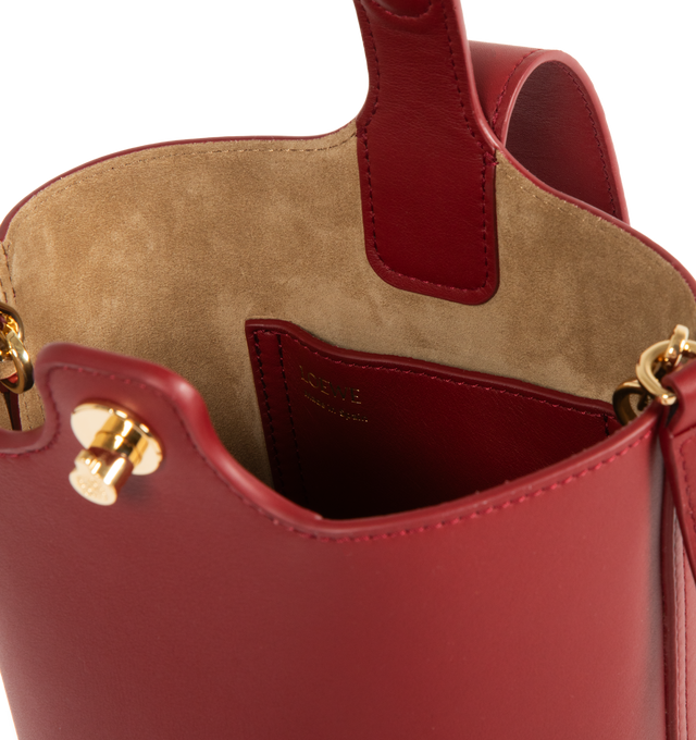 Image 3 of 3 - RED - LOEWE Mini Pebble Bucket Bag featuring magnetic closure, internal pocket, bonded suede lining, anagram engraved Pebble, crossbody, shoulder or hand carry and adjustable and removable strap. 7.7 x 6.3 x 6.3 inches. Mellow Calf. Made in Spain.  